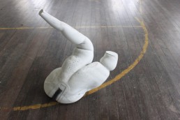 Concrete cast legs on a wooden gym floor