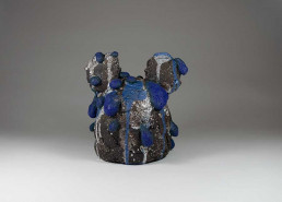 grey and blue gloopey looking ceramic sculpture